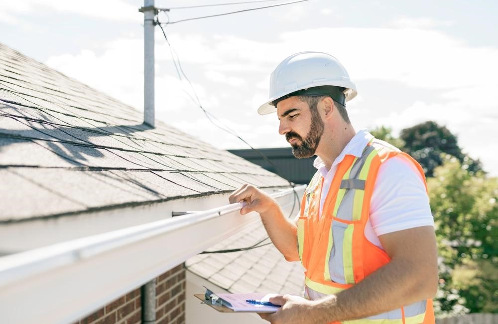 Roof Inspection While Cleaning Gutters